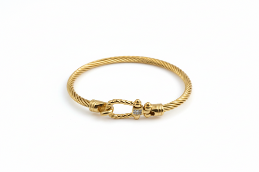 Gold horseshoe bangle with hook clasp
